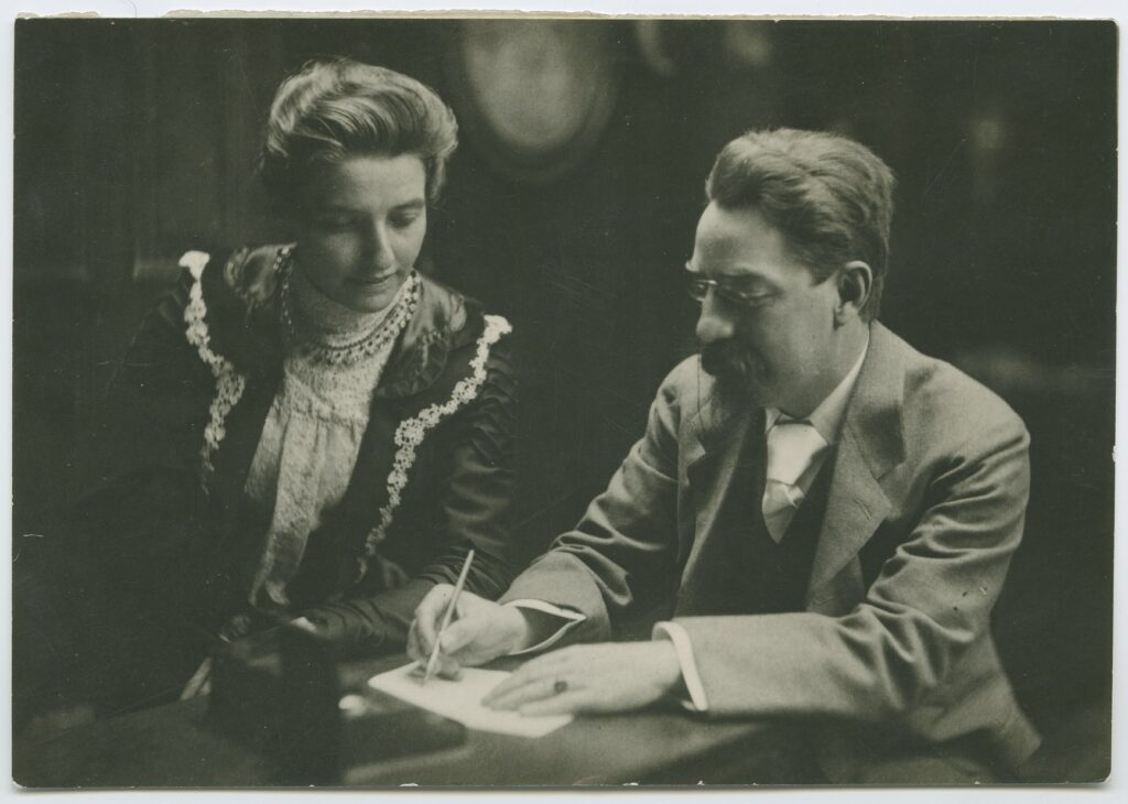 Beatrice & Sidney Webb working together at a table